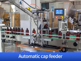 Automatic cap feeder