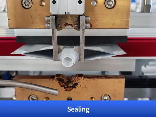 spout inserting sealing machine